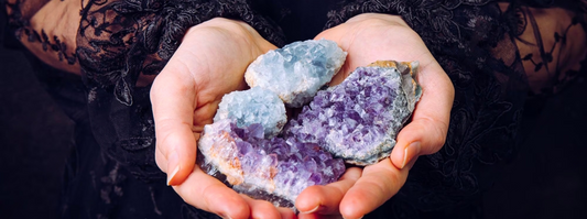 holding natural amethyst on hands